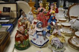 A group of hand painted porcelain figures, to include a large Lady Florist, h25cm, a Circus Clown by