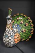 An attractive stained glass Tiffany style peacock table lamp, h29cm. Condition report: Damage to the