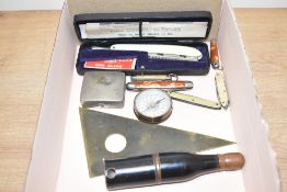 An unusual early 20th century cigarette and case in the form of a champagne bottle, indistinctly