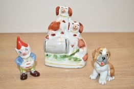 A miniature Staffordshire pottery style figure depicting two dogs and barrel, h11cm, sold together
