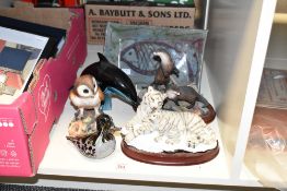 A vintage studio pottery dish decorated with an abstract fish design, makers mark to base, L28cm,