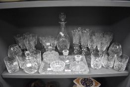 A large selection of various cut crystal glass, to include candle sticks, 8cm, lidded sugar bowl,