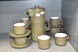 A vintage Denby part tea service, having part decorated chevron textured pattern on an olive green