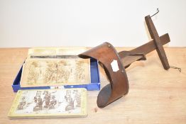 A 19th century 3-D stereoscope viewer with 36 cards, some reading, 'Who sups with the Devil needs