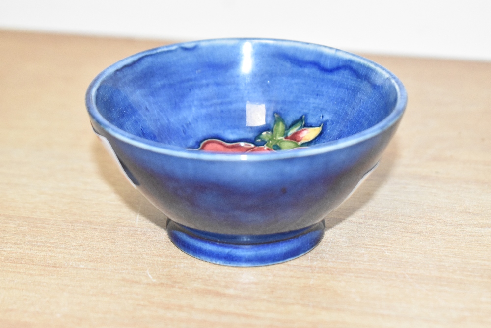 A small attractive Moorcroft pottery bowl, decorated with poppy on a blue glaze ground, pattern No. - Image 2 of 3