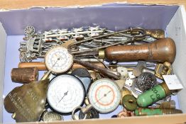 A small box containing three map mileage gauge's, a nickel heart shaped brooch reading, 'Betty