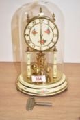 A 400 day anniversary clock by German makers Kieningerand Obergfell, beautifully decorated with
