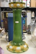 An early 20th century green porcelain Jardeniere stand, missing Jardeniere, h57cm.