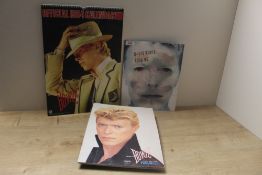 A selection of Bowie items with programmes from the 1983 and 1995 tours and a calendar from 1984