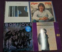 A lot of twelve vinyl albums with John Martyn and more - good shop , dealer stock and all at least