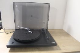 A Rega Planar 3 Turntable with dustcover in excellent condition , a highly regarded piece of kit