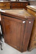 A Victorian stained pine corner cupboard, height approx. 102cm