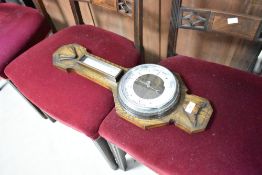 An early to mid 20th Century oak cased barometer
