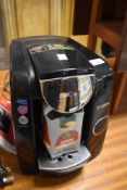 A Bosch Tassimo coffee pod machine and a part box of pods