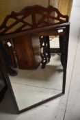 Am early 20th Century mahogany framed wall mirror, having fretwork style decoration, approx. 95 x