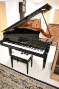 A modern Yamaha Baby Grand Piano , model GC1, serial number 5995347 (dated to 2002). Polished