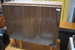 A vintage laminate gate leg kitchen table