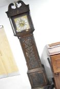 An 18th Century oak long cased clock having eight day movement with brass and silvered dial named