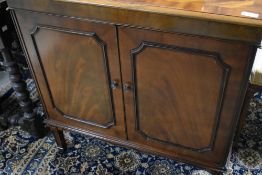 A reproduction Regency tv cabinet