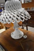 A Porcelain table lamp with foliate aplique decoration