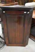 A 19th Century oak corner cupboard, height approx. 105cm