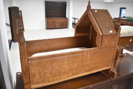 A Victorian golden oak rocking crib, approx. 87cm length