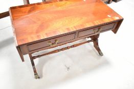 A reproduction Regency mahogany drop end coffee table, width approx. 93cm
