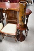 An Edwardian mahogany bedroom chair, reproduction plant stand/occasional table and carved decorative