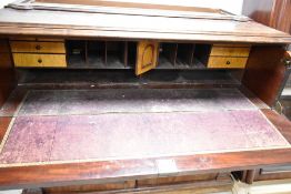 A 19th Century mahogany secretaire bookcase having glazed top and cupboard under fitted desk