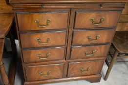 A reproduction Regency TV cabinet modelled as chest of drawers, width approx. 78cm