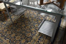 A modern glass topped office desk, approx. 150 x 70cm