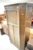 An early to mid 20th Century oak canted hall robe or wardrobe