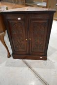 A19th Century carved corner cupboard of smaller proportions