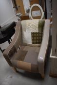 A modern tub chair having patchwork theme, width approx. 67cm