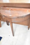 A 19th Century mahogany demi lune fold over tea table, width approx. 90cm