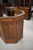 A traditional golden oak church pulpit/lecturn, with brass plaque in mrmory of Rev William Goad