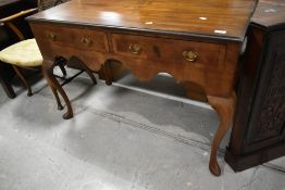 A 19th Century Queen Anne style side table with two frieze drawers and apron, on cabriole legs
