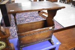 A reproduction oak Titchmarsh and Goodwin style magazine table, width approx. 50cm