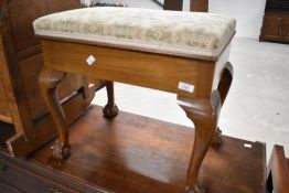 An early 20th Century mahogany Queen Anne style piano stool