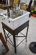 A vintage belfast style sink with measure/feeder attachment on bespoke wood and cast stand approx.