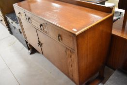 An early 20th Century oak sideboard, width approx. 135cm