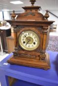 A traditional mahogany cased mantel clock in the 19th Century style with enamelled dial and arabic