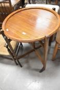 An early 20th Century oak 'Revertable' card/tea table, diameter approx. 61cm