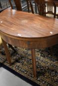 A 19th Century mahogany demi lune fold over tea or dining table, diameter approx. 100cm