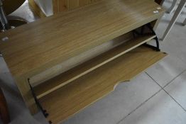 A beech effect laminate show bench having drop front, width approx. 100cm