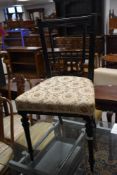 A Victorian ebonised bedroom chair in the Aesthetic style