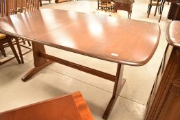 An Ercol extending dining table, medium/dark stained