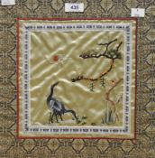 Two Chinese embroidered silk-work panels, depicting cranes within landscape settings, within