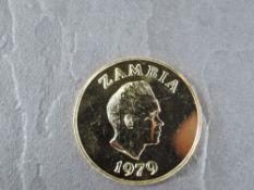 A 1979 Zambia 250 Kwacha Gold Coin, African Wild Dog to reverse, Uncirculated in plastic capsule and