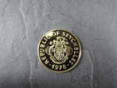 A 1978 Seychelles 1500 Rupees Gold Coin, Flycatcher to reverse, Uncirculated in plastic capsule
